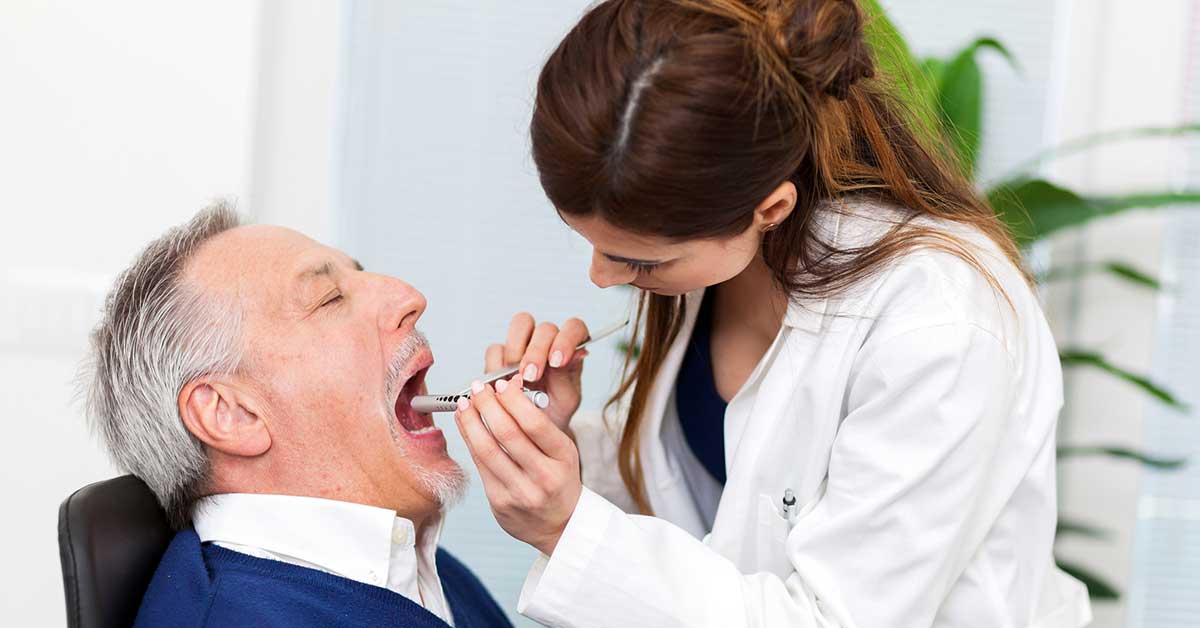Doctor examining a patient in her office