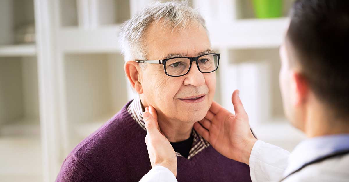 Doctor checking patient lymph nodes