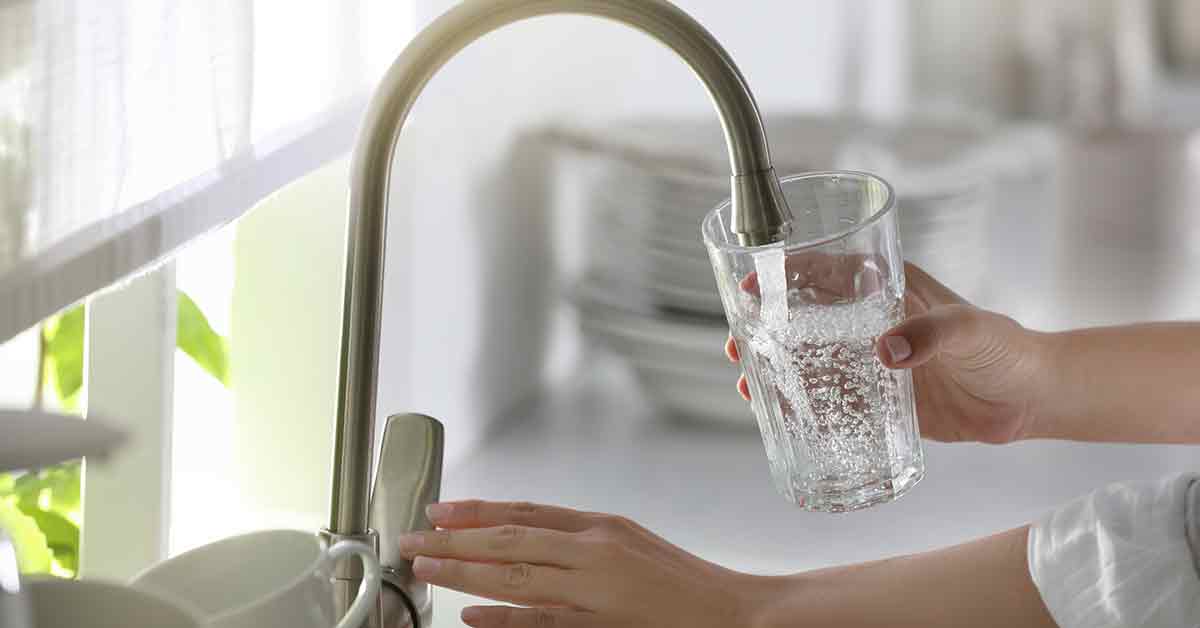 Glass of Tap water being filled