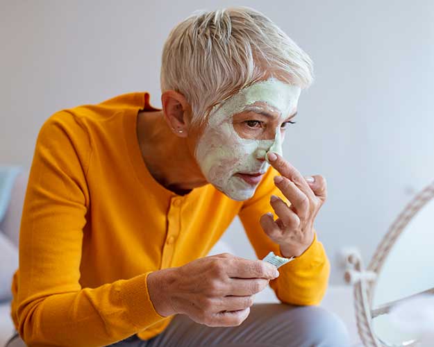 Woman with Face Cream on