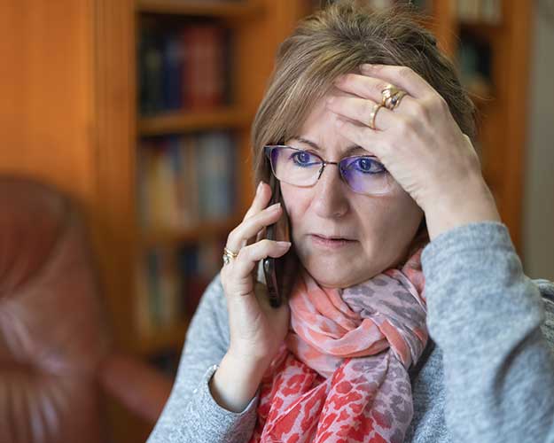 Worried woman on the phone