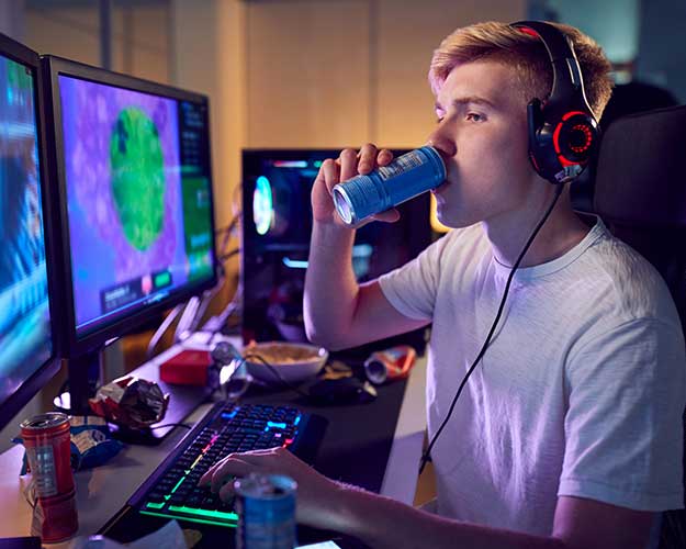 Teen drinking energy drink