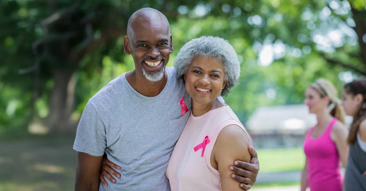 Couple with breast cancer awareness ribbons