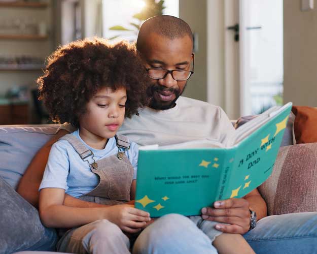 Father reading to young son