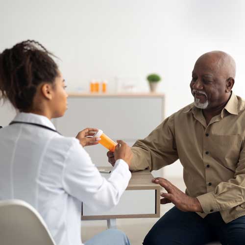 Man talking to doctor about medication