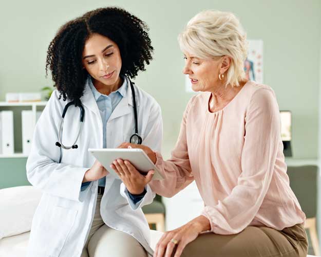 doctor with mature patient for medical service, consulting and help in clinic