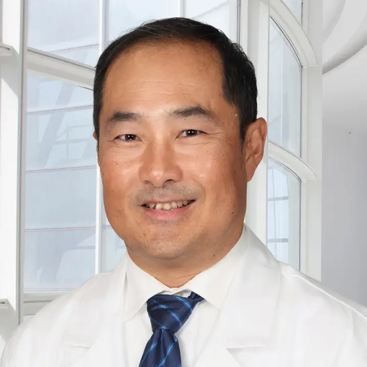 Portrait of a board-certified medical oncologist with Florida Cancer Specialists & Research Institute.