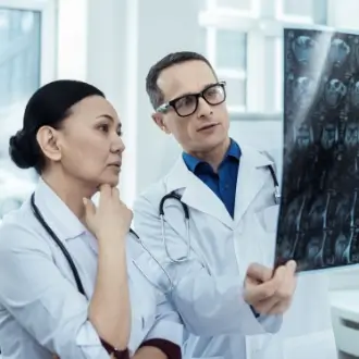FCS physician recognized as a Top Doctor meeting with a cancer patient